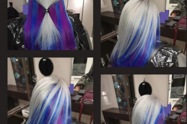 An image of a woman who hair has been dyed white and vibrant purple.